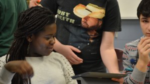 Classmates collaborate and share ideas and products.