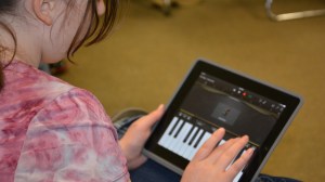 Student works on iPad keyboard