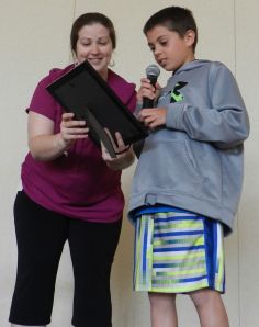 Devon and Eric read a poem written by his grandmother for his birthday, "Eric the Great"