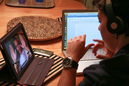 student with laptop and iPad